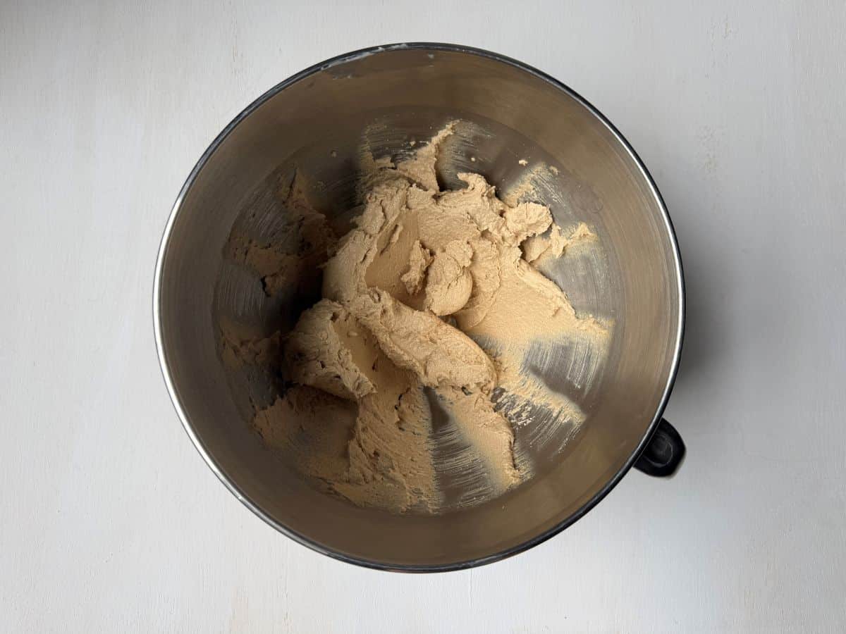 chocolate chip cookie batter in a metal mixing bowl