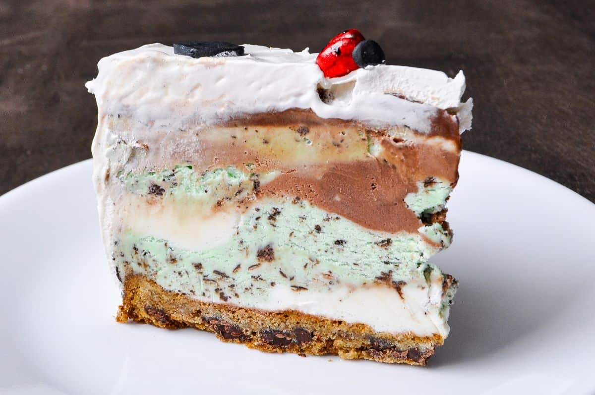 a slice of chocolate chip cookie crust ice cream cake to show the layers of ice cream